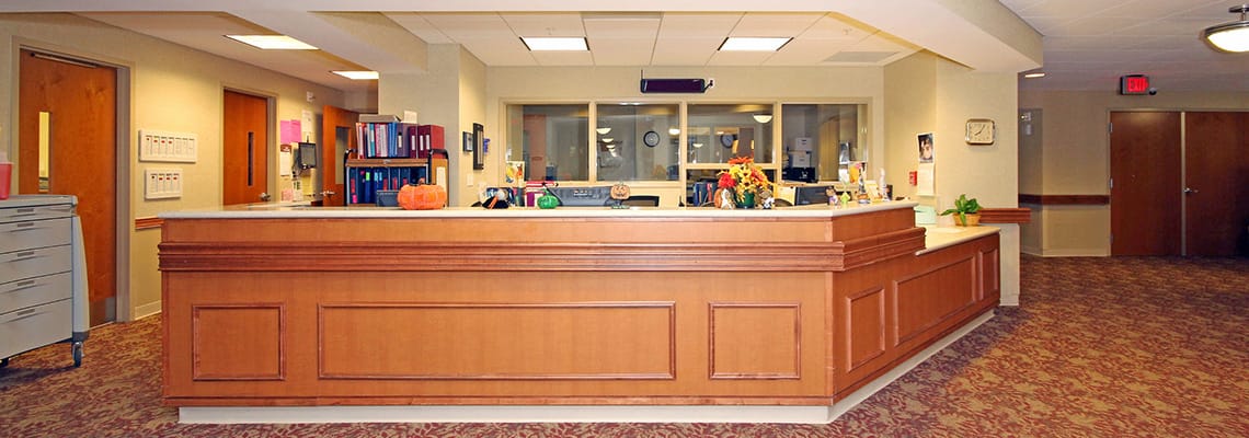 Reception area of a nursing home with a front desk