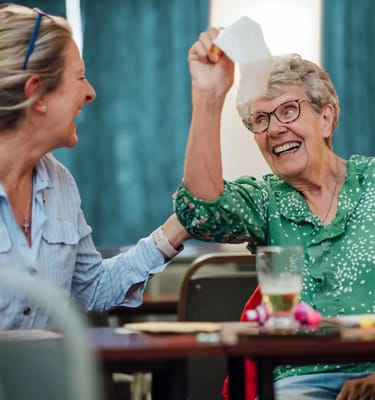 Residents enjoying a fun activity together in the common area
