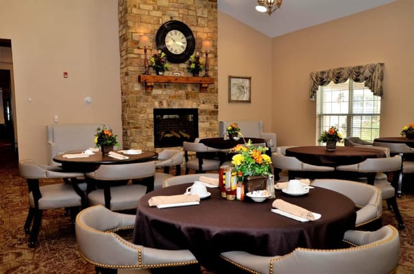 Elegant dining area with tables and floral arrangements