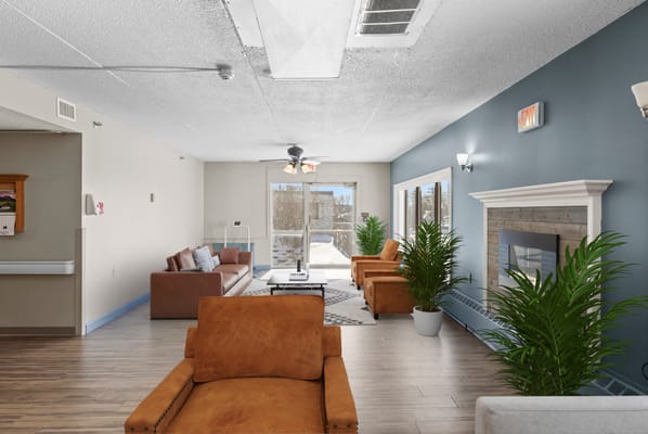 Bright common area with seating and plants