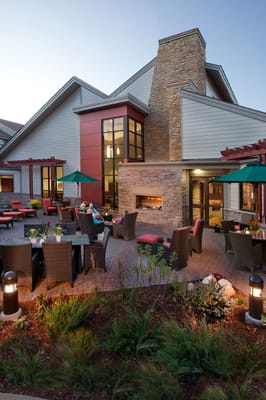 Outdoor patio area with residents enjoying the space
