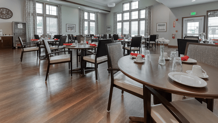Dining room setup with plates and utensils ready for service