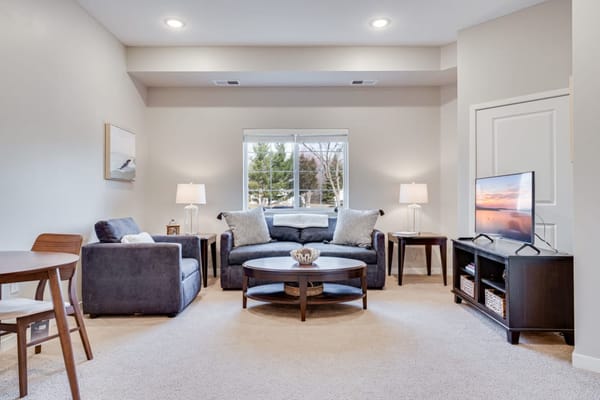 Bright common area with comfortable seating and natural light