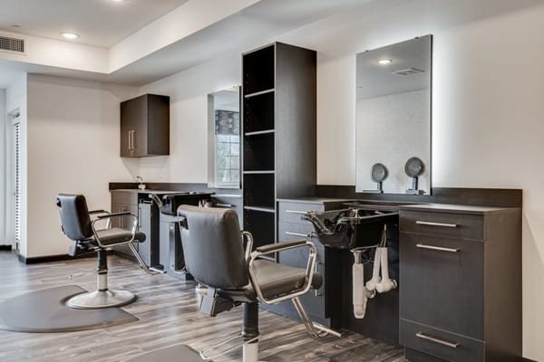 Interior of a hair salon with styling chairs and mirrors