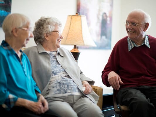 Residents enjoying a conversation in a common area