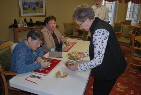 Residents engaging in an activity with snacks
