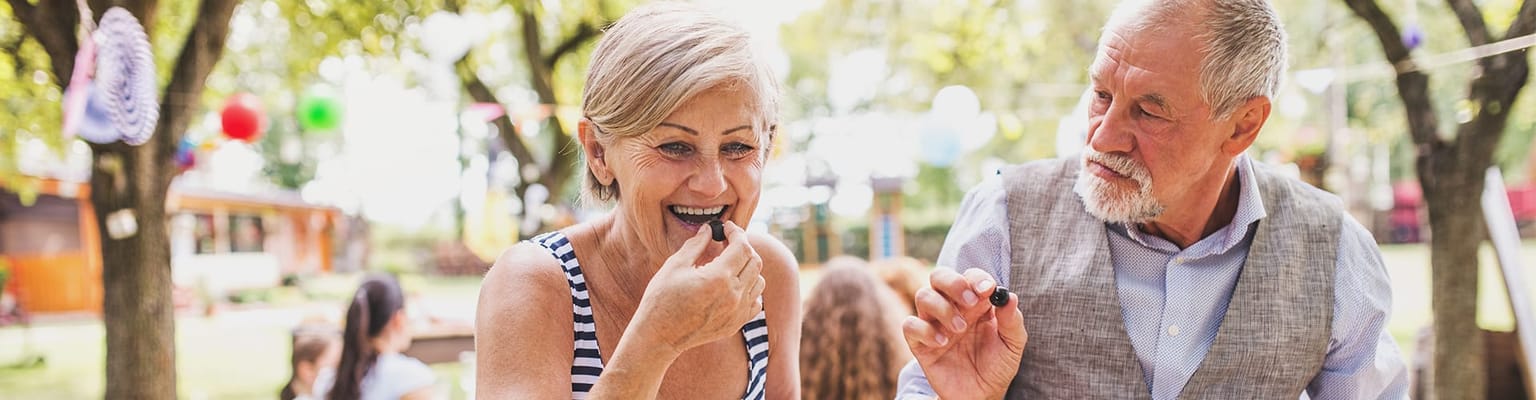 Residents enjoying fresh blueberries outdoors