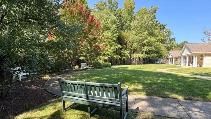 Outdoor view with a bench in a landscaped area