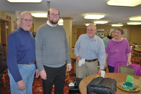 Residents and staff interacting in a common area