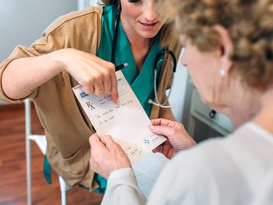 Healthcare professional interacting with a resident
