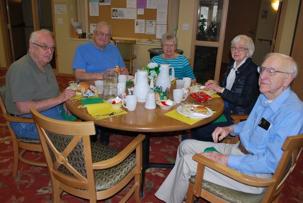 Residents enjoying a meal together in a dining area