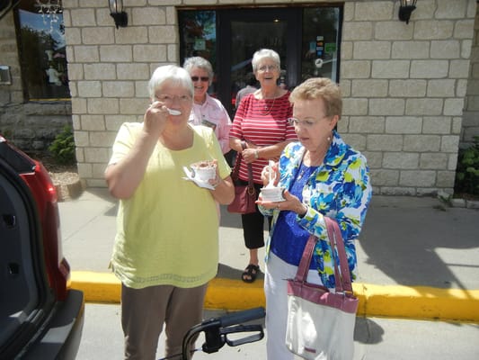 Residents enjoying ice cream outside the facility
