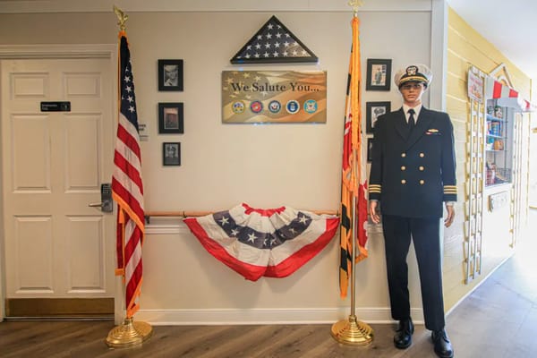 Interior decoration honoring veterans with flags and a uniform