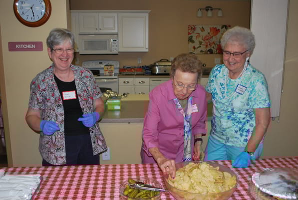 Residents preparing snacks in the kitchen