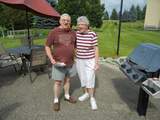 Residents enjoying a sunny day in the outdoor space