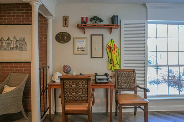 Cozy interior space with a desk and chairs