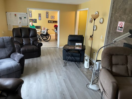 Common area with residents and seating.