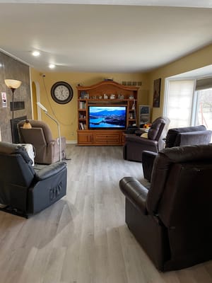 Cozy common area with comfortable seating and a TV