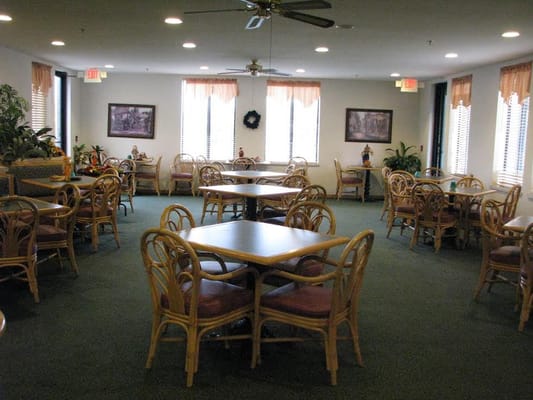 Interior view of a dining room with tables and chairs