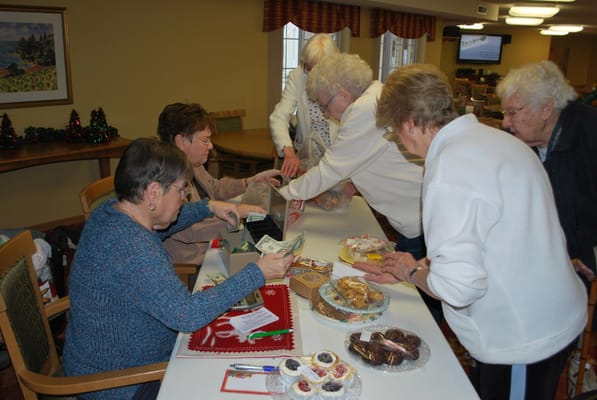 Residents participating in a holiday bake sale activity