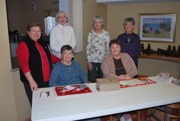 Residents engaging in a festive activity indoors