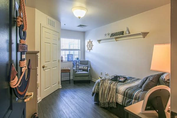 Cozy resident room with nautical decor and warm lighting