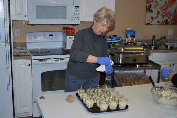 Resident preparing meals in a kitchen area