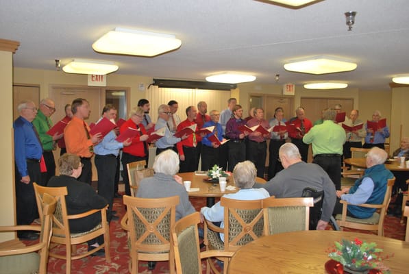 Residents and staff participating in a choir performance