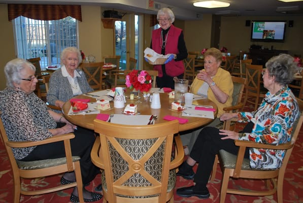 Residents enjoying a meal together in the dining room
