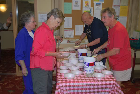 Residents engaged in an activity, preparing food together