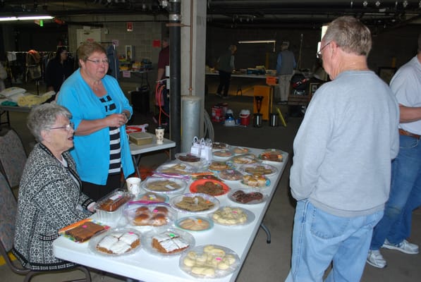 Residents enjoying homemade baked goods at a communal event