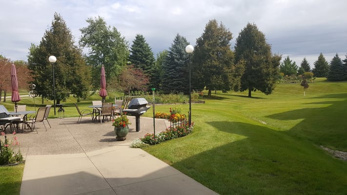 Outdoor patio area with tables and flowers