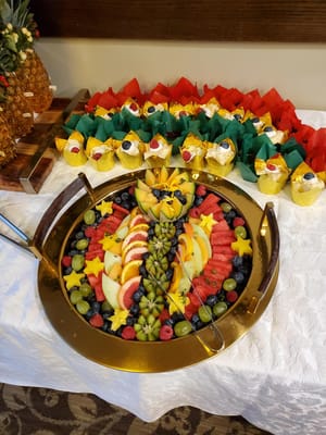 Beautifully arranged fruit and cupcakes on a table