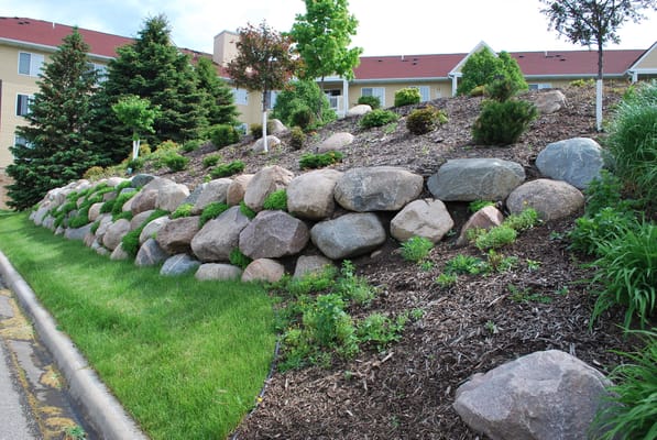 Well-maintained garden with rocks and landscaping