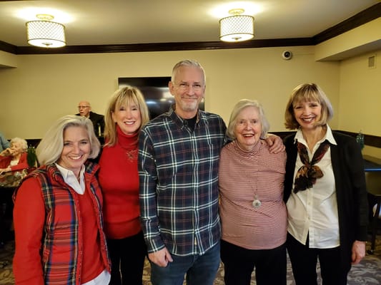 Residents and staff posing together in a common area