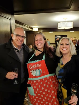 Staff and residents celebrating together indoors