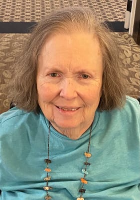 Resident smiling in a common area