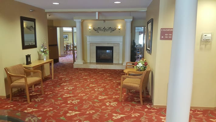 Interior view of a cozy common area with fireplace
