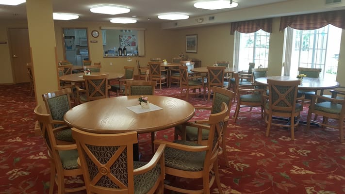 Bright dining area with tables and chairs