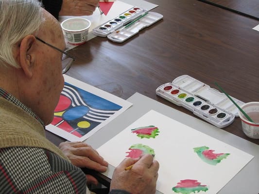Resident engaged in a painting activity