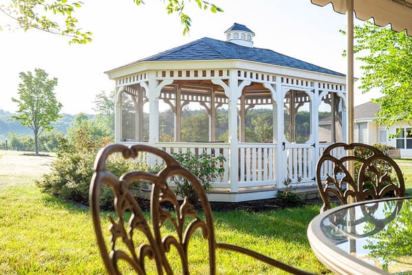 Outdoor gazebo surrounded by greenery