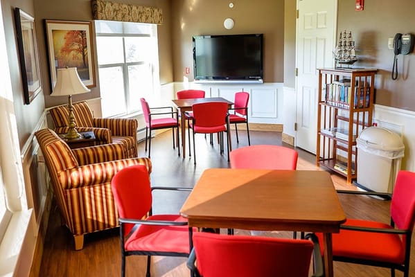 Interior common area with seating and a television