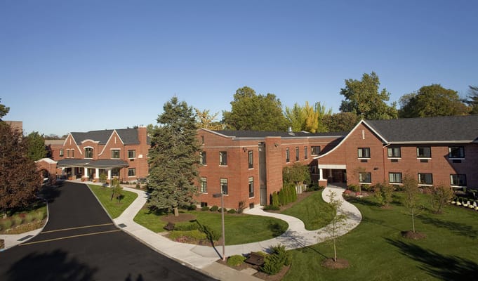 Exterior view of a nursing facility with landscaped grounds