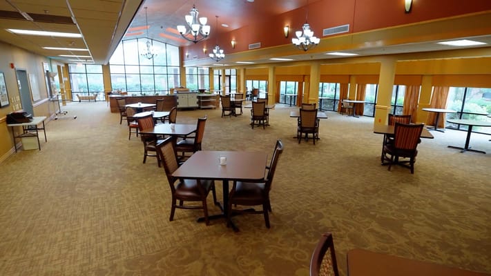 Interior view of a common area with tables and chairs