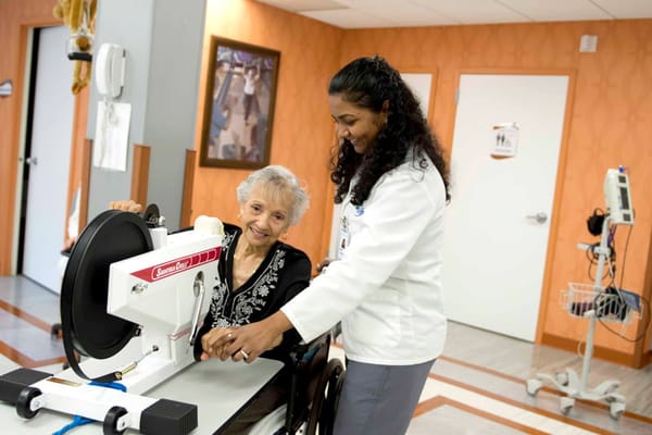 A resident engaging with staff in a therapy session