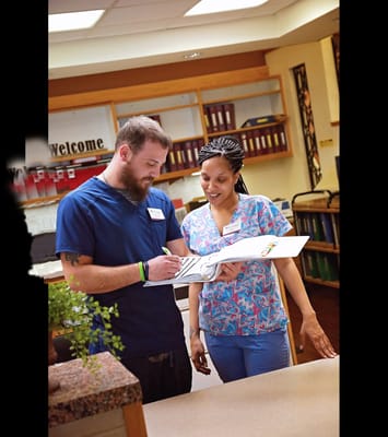 Staff members interacting in a welcoming lobby