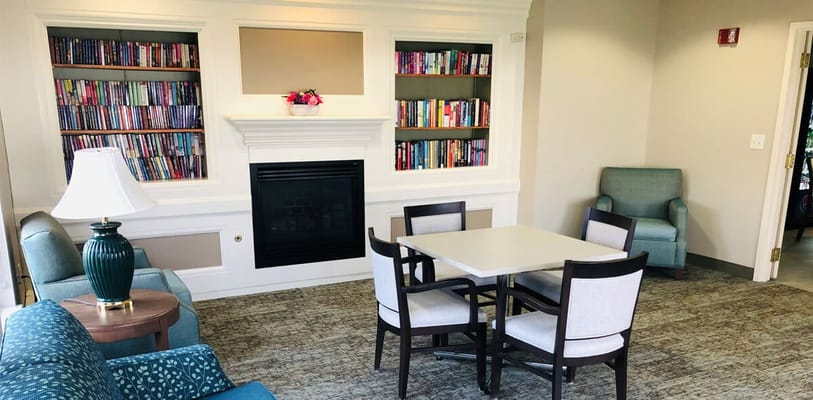 Cozy common area with bookshelves and seating
