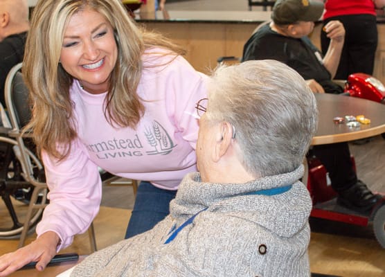 Staff interacting with a resident in a common area