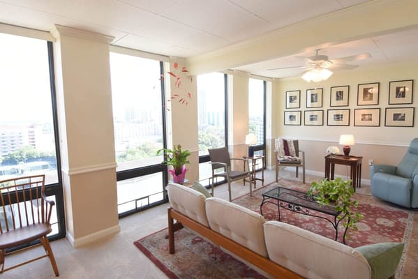 Bright interior common area with seating and windows