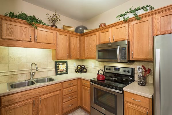 Modern kitchen with wooden cabinets and appliances